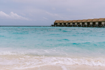 View of overwater bungalows in the sea. A peaceful and scenic island moment capturing the essence...