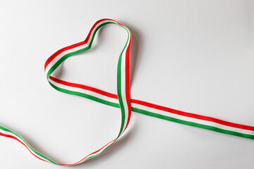 Heart shape with Hungarian tricolor ribbon on white background