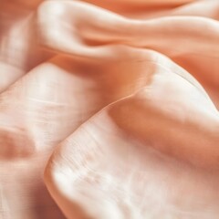 Fototapeta premium Peach Silk Fabric Texture Draped Elegant Smooth Soft Background