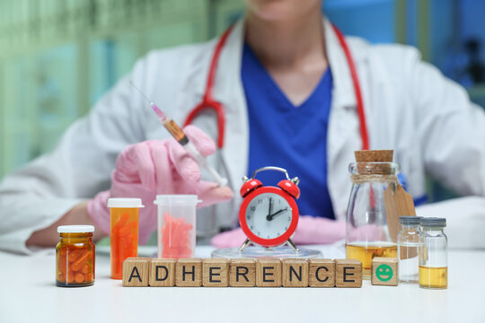 A healthcare professional emphasizes the importance of medication adherence with various pill bottles.