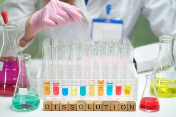 In a laboratory setting, a scientist is conducting a fascinating dissolution experiment using...