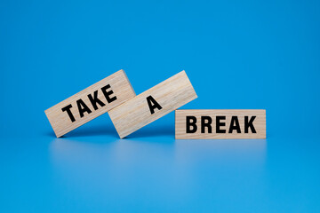 take a break words symbol on wooden blocks isolated on blue background