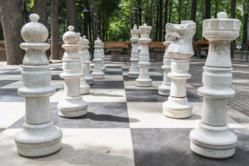 Bishkek, Kyrgyzstan - May 27, 2025: Giant chess pieces on a chessboard on Erkindik Boulevard in...