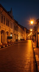 Fototapeta premium Serene Night in Historic Street of Old Town, Cobblestone Road Illuminated by Golden Lights, Architectural Gems at Twilight