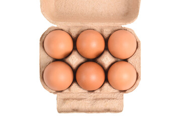 Open egg box with six brown eggs isolated on white background with clipping path. Top view
