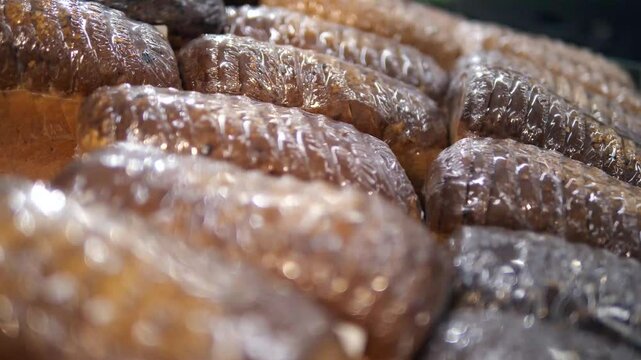Lots of bread or loaf lying in a row.