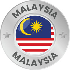 Malaysia flag in silver colored medal. National flag in metal circle emblem.
