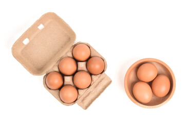 Eggs in paper tray isolated on white background. Top view