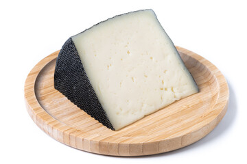 Close-up of a wedge of semi-cured cow's cheese isolated on white background