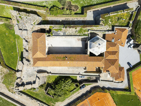 Aerial view of Forte de S&Atilde;&pound;o Francisco Xavier's terracotta roofs contrasting with the surrounding green grass and stone walls, Porto, Porto District, Portugal.