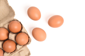 Eggs in paper tray isolated on white background. Top view