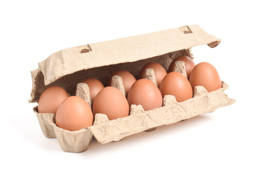 Open egg box with brown eggs isolated on white background with clipping path. Fresh organic chicken eggs in carton pack or egg container