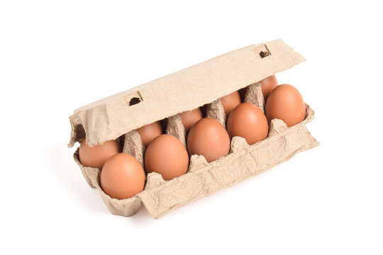 Open egg box with brown eggs isolated on white background with clipping path. Fresh organic chicken eggs in carton pack or egg container