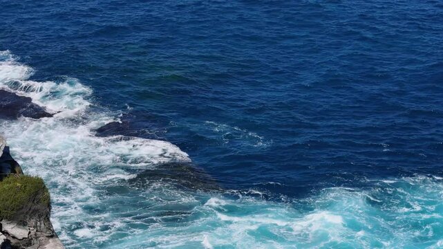 Kurnell, Sydney, Australia-UHD Drone Video: Breathtaking view flying above waves splashing on the sandstone cliffs, on the coast of the scenic Cape Baily Track in Kamay National Park.