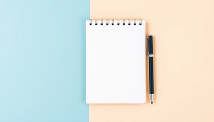 Blank notepad and pen on pastel background