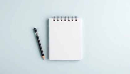 Blank notepad and pencil on blue background (1)