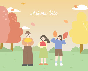 낙엽을 들고 가을 풍경을 즐기는 사람들