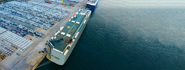 Modern vehicle logistics hub with cargo ships and freshly produced cars ready for overseas shipment...