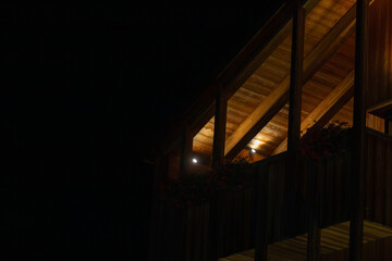 Beautifully Illuminated Wooden Building Facade Captured During a Tranquil Night Scene