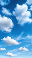 Obraz premium Beautiful white clouds in a bright blue sky during daytime