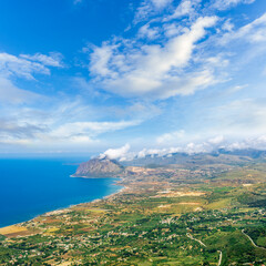 panoramic view of summer season landscape from above of beautiful valley with green fields and blue...