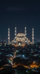 Majestic Night View of Sultan Agung Mosque, illuminated against the dark night sky, overlooking a city filled with twinkling lights.