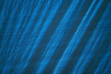 blue texture, abstract background, plastic tarp, tarpaulin, diagonal lines, pattern, fabric...