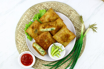 Martabak telur, Indonesian popular folded omelet made from egg, green onion, and wrapped with...
