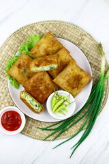 Martabak telur, Indonesian popular folded omelet made from egg, green onion, and wrapped with...