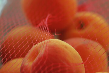 apricots, fruit, mesh bag, close-up, macro, ripe, orange, summer, fresh, healthy, texture, natural,...