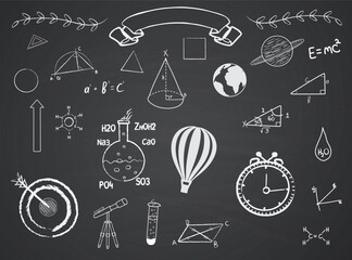 set of hand drawn chalk educational doodles on blackboard