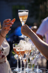 glasses with dry ice. original serving of drinks. champagne glass tower