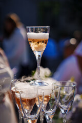 glasses with dry ice. original serving of drinks. champagne glass tower