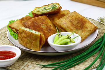 Martabak telur, Indonesian popular folded omelet made from egg, green onion, and wrapped with...