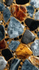 Detailed arrangement of colorful stones and pebbles on a golden background showcasing natural textures and patterns