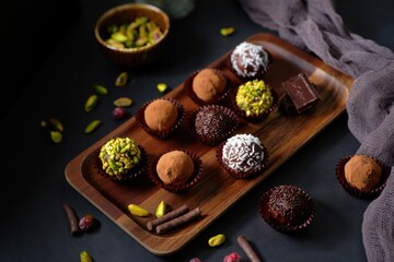 Deliciously Crafted Assortment of Chocolate Truffles Adorned with Nuts, Sprinkles, and Exotic Flavors for the Ultimate Indulgent Experience
