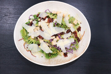 caesar salad or vegetable salad with bacon and cheese