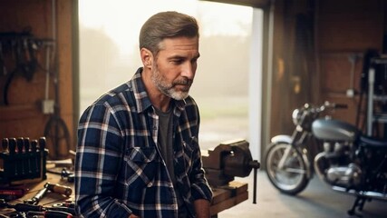 A handsome craftsman takes a coffee break in his garage, standing confidently near his motorcycle, a scene representing skilled labor, hobbies, and masculine lifestyle branding