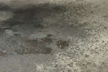 Stains of motor oil on asphalt outdoors, closeup