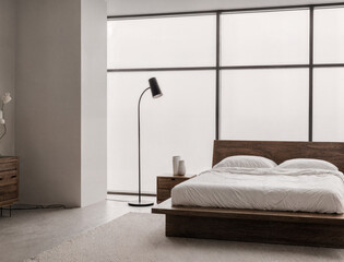 Minimalist mid-century bedroom with platform walnut bed, crisp white linen sheets, and high vaulted ceiling.