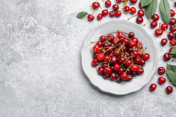 Fresh ripe cherries on light table, flat lay. Space for text