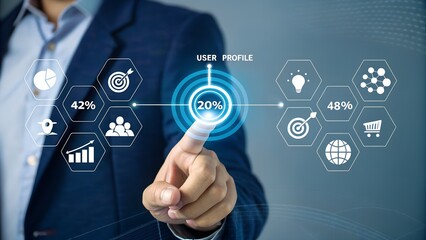 Naklejka premium A professional hand interacts with a futuristic virtual display showing user profile data and business analytics for strategic digital management.