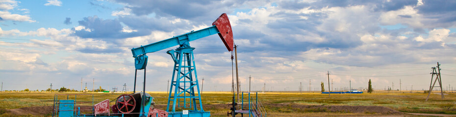 oil pump against sky background banner