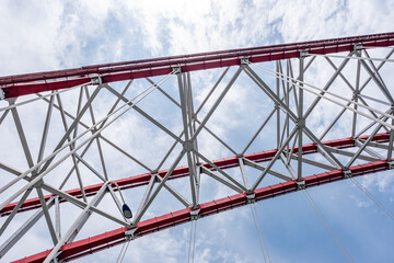steel beams is bolted down. Close-up shows the connection of the metal powerful straight crossbar,...