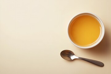 A pale beige setting depict dish of honey butter sauce and metal spoon depict notion of sweet condiments and useful delish food, Generative AI.