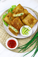 Martabak telur, Indonesian popular folded omelet made from egg, green onion, and wrapped with...