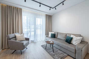 Modern and Minimalist Living Room With Comfortable Furniture and Warm Lighting
