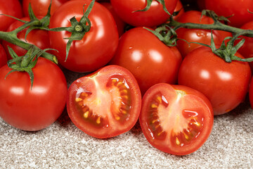 Lots of ripe fresh cocktail tomatoes close-up.