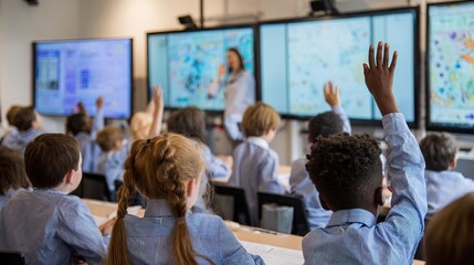 A diverse classroom of attentive students raises their hands to answer while a teacher stands in front of multiple digital screens displaying educational content.
