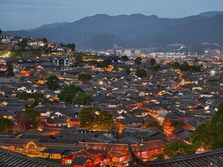 Aerial view of Lijiang city and the Yulong Snowy Mountain in Lijiang, Yunnan, China